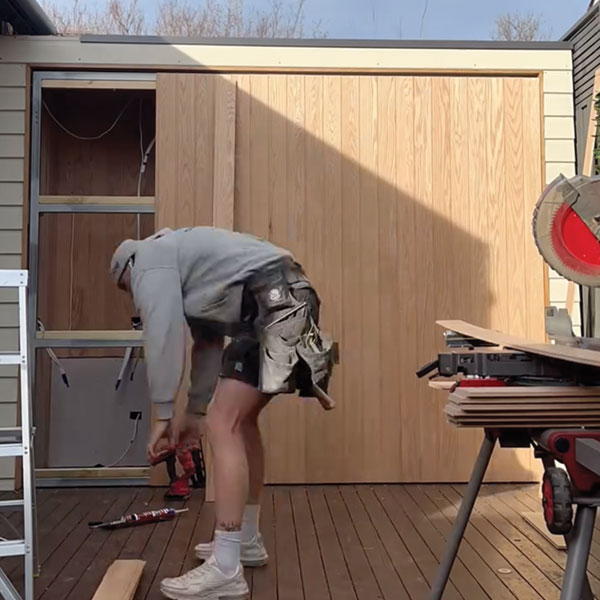 finishing off the door of the bbq area